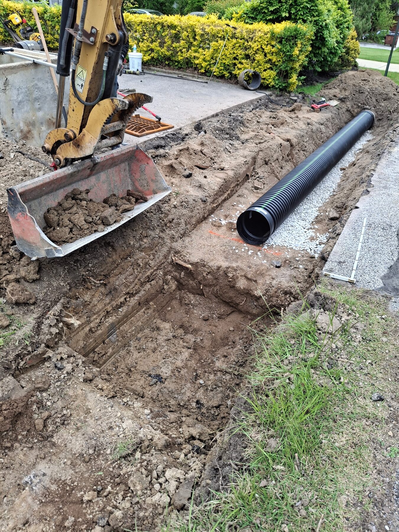 Excavation and drainage pipe installation